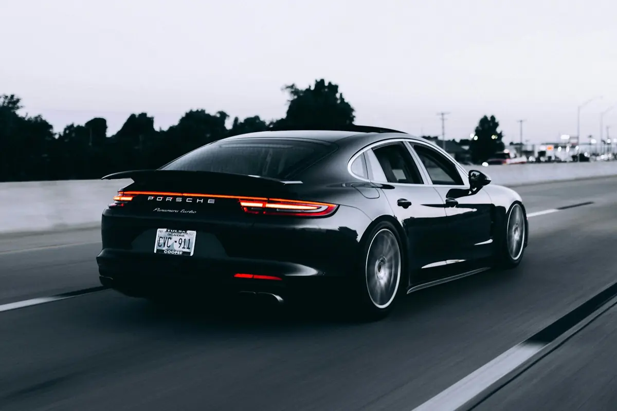 Sports car driving on an open road